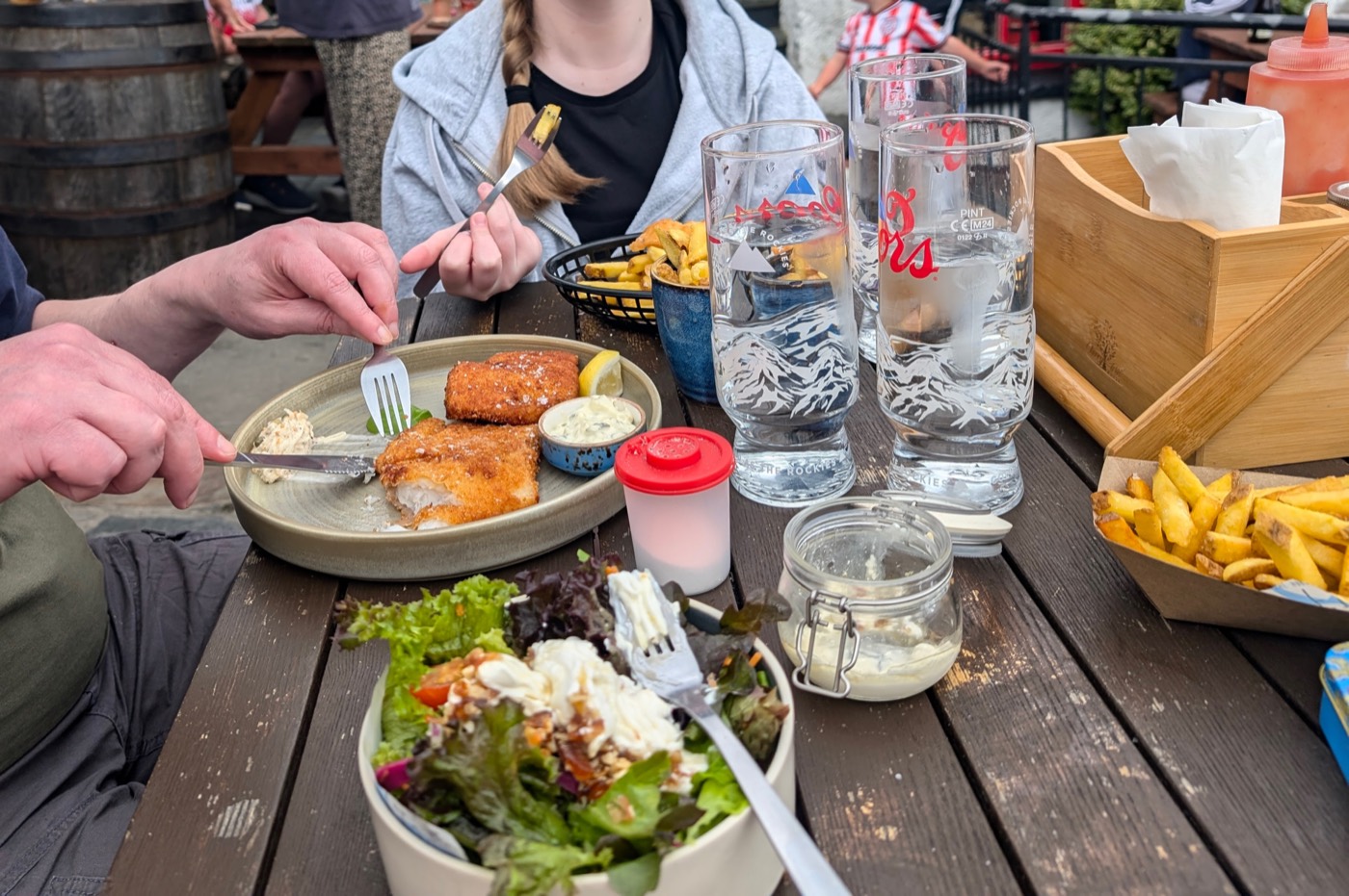 An outdoor meal at Fisk @ The Harbour Bar in Downings, Co. Donegal — fish goujons, chips and a fresh salad